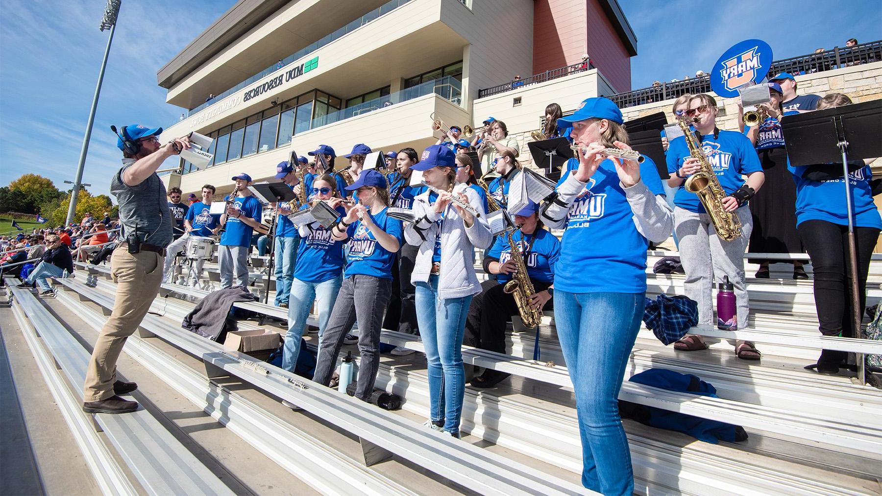 Pep band students at a football game